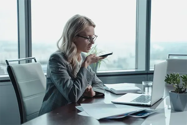 Businesswoman Employing Speech-to-Text Tech